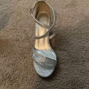 Silver pump heels. Size 6 1/2. New, never worn